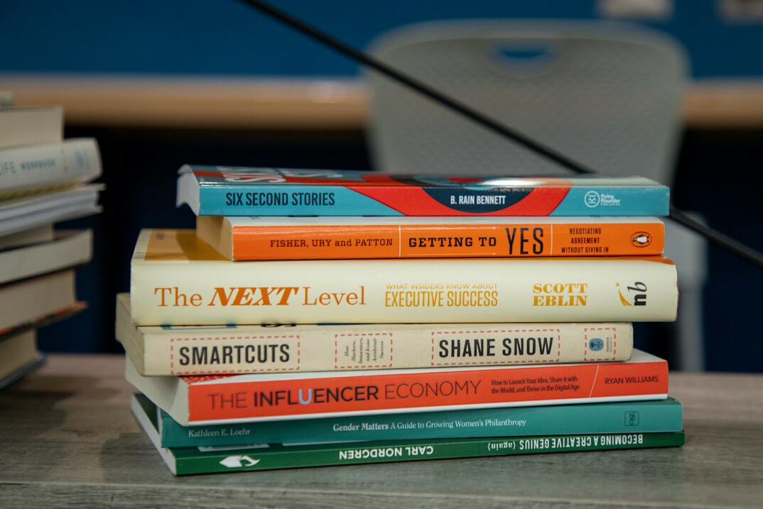 Neat stack of programming and technology books
