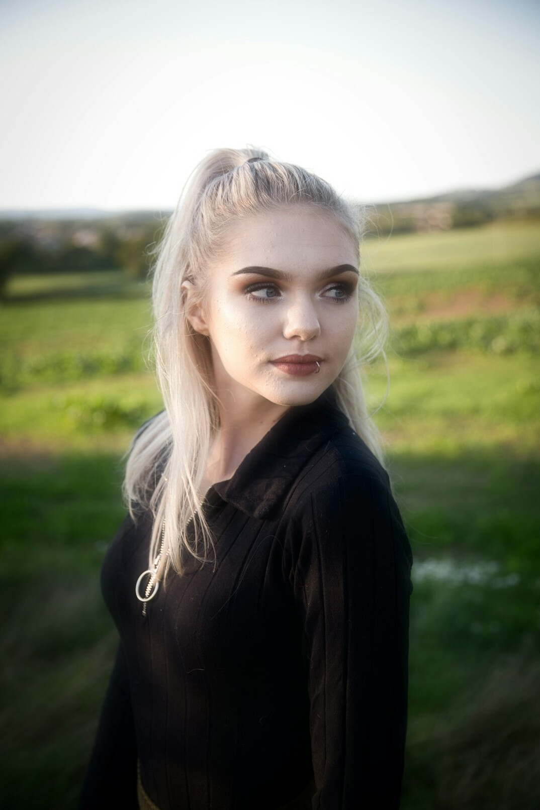 Portrait of a smiling Croatian woman in her thirties with shoulder-length blonde hair