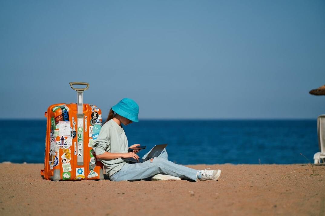 person coding on laptop