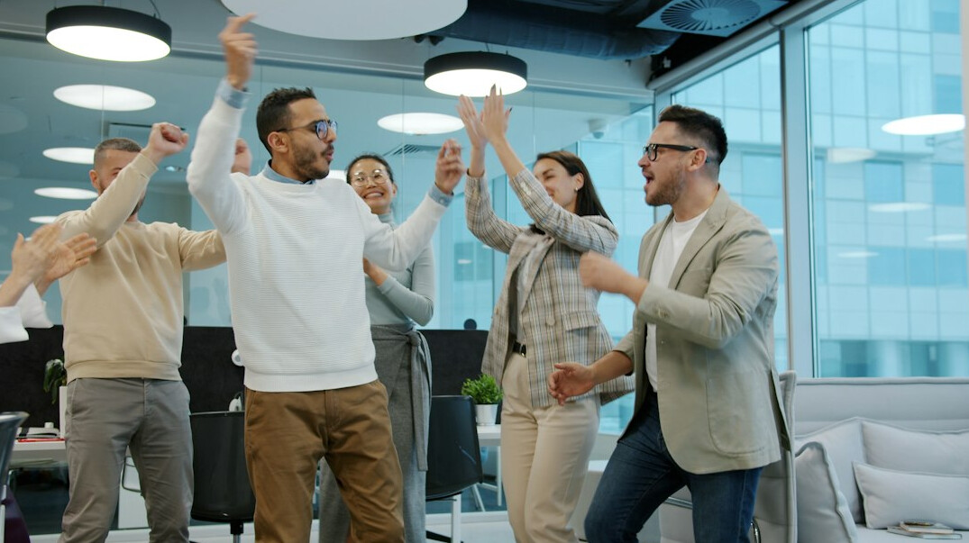 group of programmers celebrating