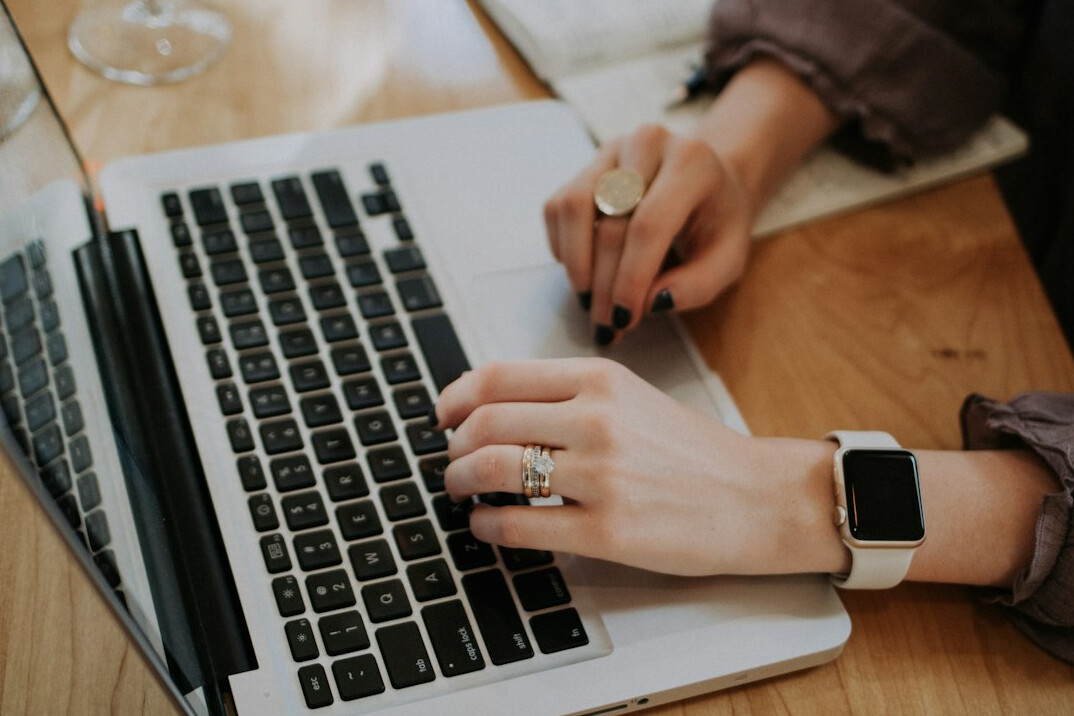 person using laptop for budgeting